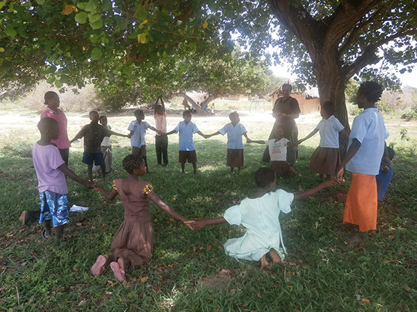 children holding hands in circle